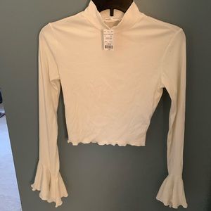 Bell-sleeve turtleneck crop top